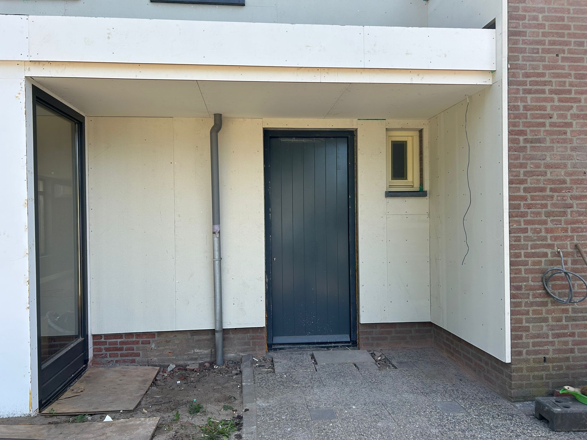 Huis bekleden met stucbeplating